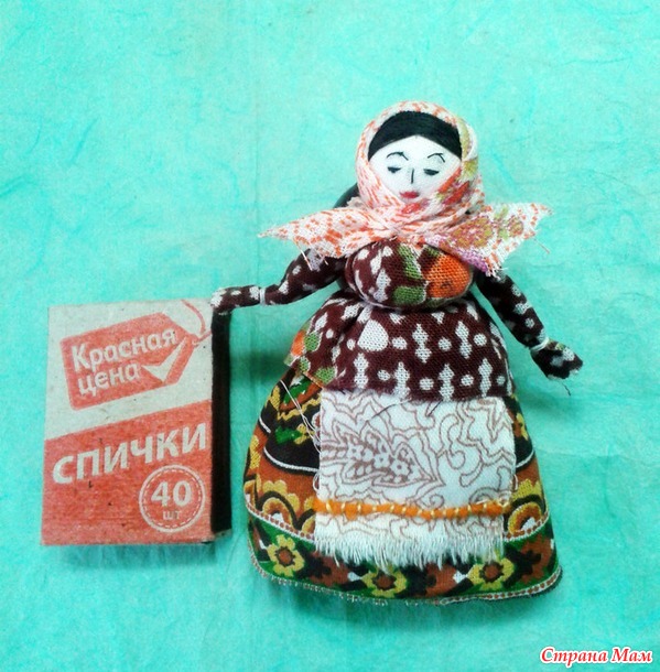 кукла на катушечной шпульке.