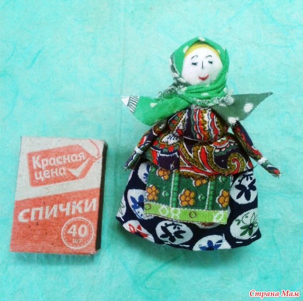 кукла на катушечной шпульке.